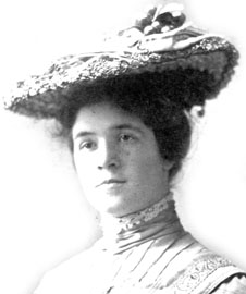 Portrait of Grace Collins Campbell.  A pleasant looking woman about thirty years old wearing a stiff collared dress and a fairly fancy hat.